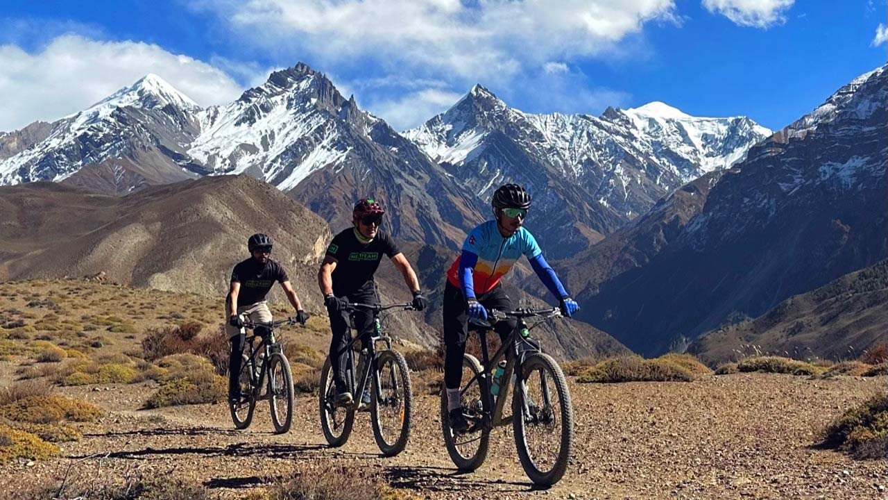 Three mountain bikers shredding the Lupra singletrack during Mustang MTB adventure in Nepal.