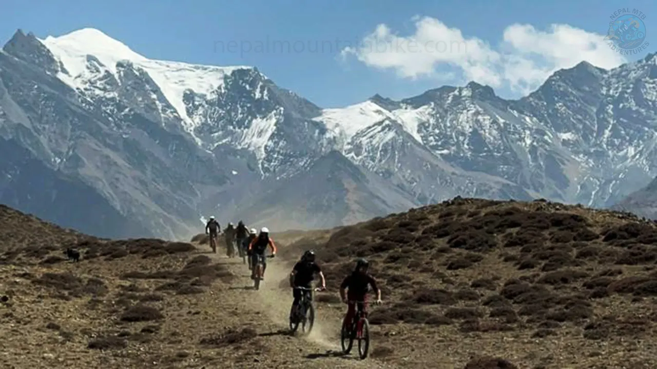 Group of mountain bikers riding the Lupra singletrack in Mustang during the Nepal Enduro MTB tour.